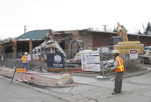 Rick Egan   |  The Salt Lake Tribune
R & O Construction crews demolish part of the old Emigration Market Wednesday. The newest and smallest Harmons store will feature artisan breads, a coffee bar, organic and traditional produce and fresh delicatessen fare.