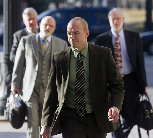 Al Hartmann  |  The Salt Lake Tribune 
Tim DeChristopher arrives with his legal team at the Frank Moss Federal Courthouse on Wednesday.