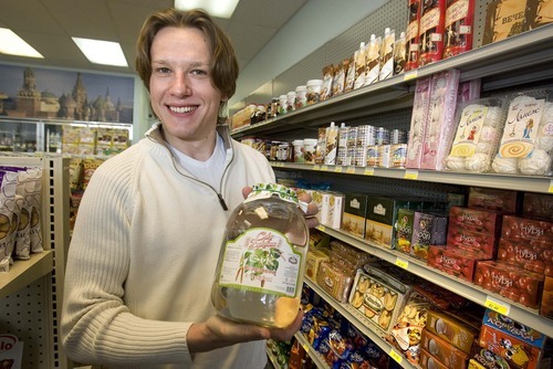 Paul Fraughton  |  The Salt Lake Tribune
Leo Balitskiy holds up a jar of birch juice, one of the many Russian food items he stocks in his Moscow Gourmet Food and Gifts in Draper.