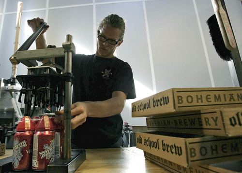 Leah Hogsten  |  The Salt Lake Tribune
Brian Erickson places tabs on six-packs of Viennese Lager at Bohemian Brewery in Midvale.