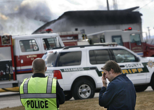 Scott Sommerdorf  |  The Salt Lake Tribune
Gary Clark, co-owner and chemical engineer at Clear Sky Biofuels in Clearfield, speaks to a police officer about fire Friday that destroyed his business and an adjoining auto-repair shop.