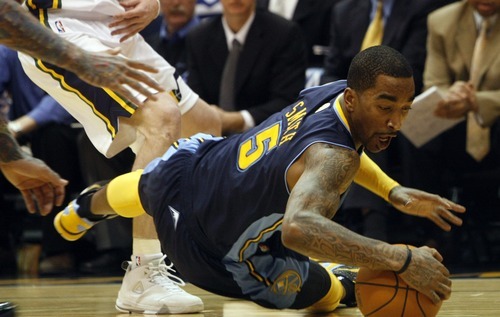 Photo by Chris Detrick | The Salt Lake Tribune 
Denver Nuggets shooting guard J.R. Smith (5) dives for the ball past Utah Jazz small forward Gordon Hayward (20) during the second half of the game at EnergySolutions Arena Thursday March 3, 2011.  Denver won the game 103-101.