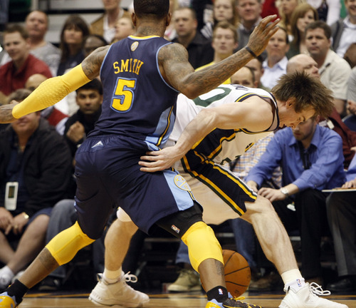 Photo by Chris Detrick | The Salt Lake Tribune 
Denver Nuggets shooting guard J.R. Smith (5) guards Utah Jazz small forward Gordon Hayward (20) during the second half of the game at EnergySolutions Arena Thursday March 3, 2011.  Denver won the game 103-101.