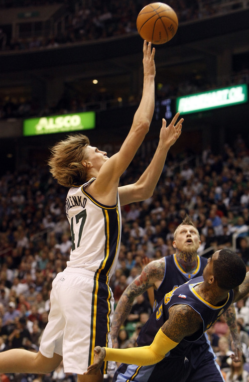 Photo by Chris Detrick | The Salt Lake Tribune 
Utah Jazz small forward Andrei Kirilenko (47) shoots over Denver Nuggets shooting guard J.R. Smith (5) and Denver Nuggets center Chris Andersen (11) during the second half of the game at EnergySolutions Arena Thursday March 3, 2011.  Denver won the game 103-101.