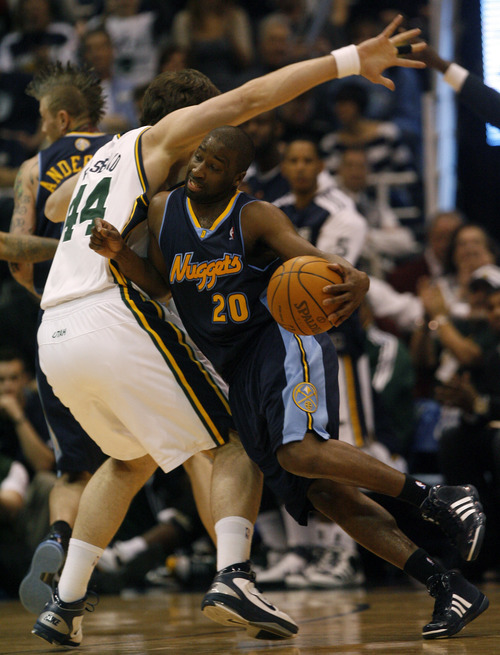 Photo by Chris Detrick | The Salt Lake Tribune 
Utah Jazz center Kyrylo Fesenko (44) guards Denver Nuggets point guard Raymond Felton (20) during the second half of the game at EnergySolutions Arena Thursday March 3, 2011.  Denver won the game 103-101.