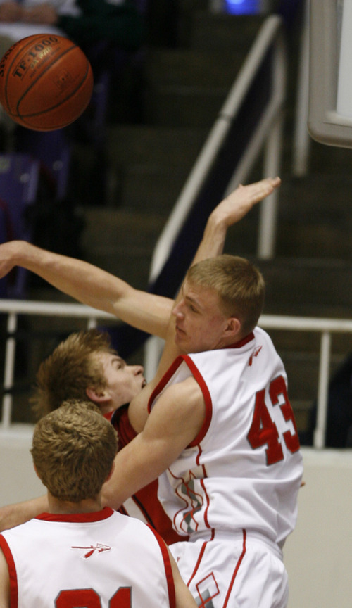 Rick Egan   |  The Salt Lake Tribune

 The Braves Jordan Parkinson (43) blocks a shot by , Nathan Israelsen, Springville, in 4A Championship basketball action,  Bountiful vs. Springville, at the Dee Event Center in Ogden, Thursday, March 3, 2011