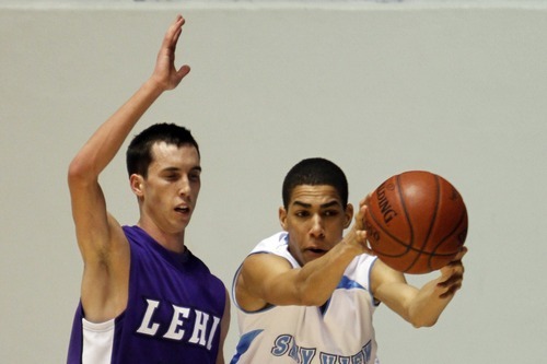 Rick Egan   |  The Salt Lake Tribune

Ryan Christofferson (32) Lehi, guards Grayson Moore (2) Sky View, in 4A Championship basketball action,
 Lehi vs. Sky View,  at the Dee Event Center in Ogden, Thursday, March 3, 2011