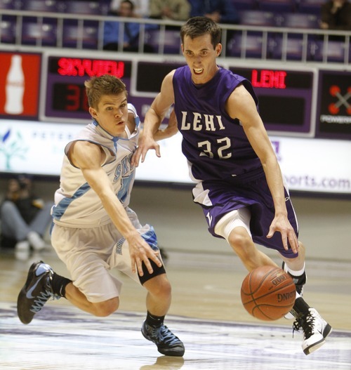 Rick Egan   |  The Salt Lake Tribune

Ryan Christofferson (32) brings the ball down court for Lehi, as Riley Knowles(10) defends for Sky View, in 4A Championship basketball action,
 Lehi vs. Sky View,  at the Dee Event Center in Ogden, Thursday, March 3, 2011