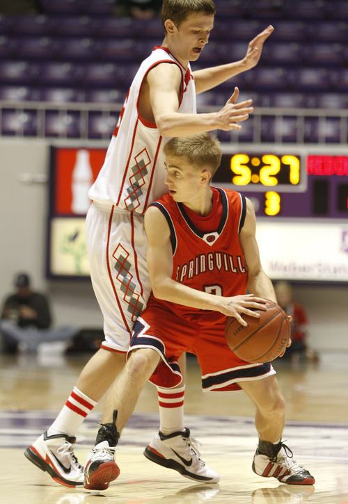 Rick Egan   |  The Salt Lake Tribune

Parker Brady, Springville, looks for an open man, as John Maxwell defends for Bountiful, in 4A Championship basketball action at the Dee Event Center in Ogden, Thursday, March 3, 2011.