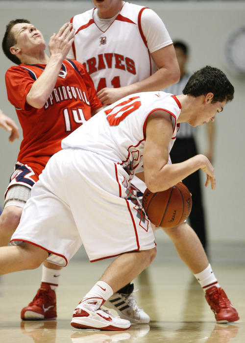 Rick Egan   |  The Salt Lake Tribune

Dillon Salazar takes the ball down court for the Braves, as Bradley Kitchen (14) defends for Springville, in 4A Championship basketball action,  Bountiful vs. Springville, at the Dee Event Center in Ogden, Thursday, March 3, 2011