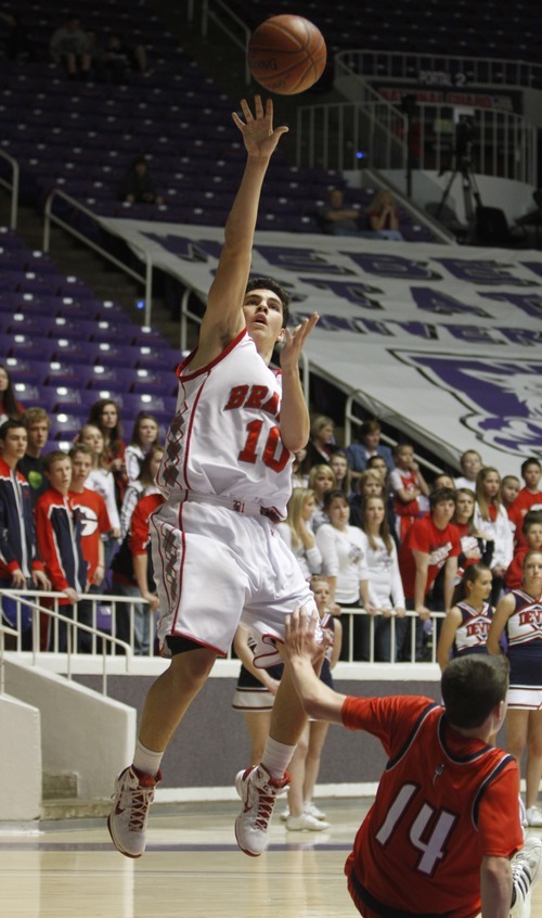 Rick Egan   |  The Salt Lake Tribune

Dillon Salazar shoots for the Braves, as Bradley Kitchen (14) takes a tumble for Springville, in 4A Championship basketball action,  Bountiful vs. Springville, at the Dee Event Center in Ogden, Thursday, March 3, 2011