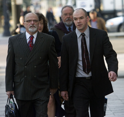 Al Hartmann   |  The Salt Lake Tribune 
Tim DeChristopher, right,  enters Frank Moss Federal Courthouse in Salt Lake City on Thursday, March 3 with his lawyer Ron Yengich.
