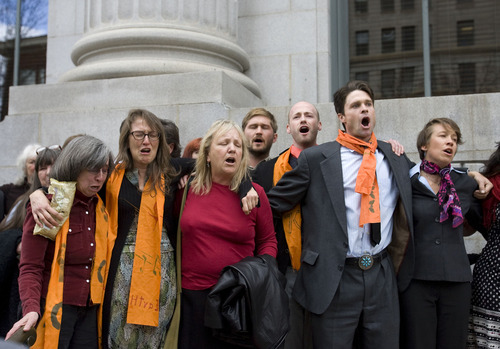 Al Hartmann   |  The Salt Lake Tribune 
Tim DeChristopher supporters sing and get emotional outside the Frank Moss Federal Courthouse in Salt Lake City March 3 after DeChristopher  was found guilty of crashing a federal oil and gas lease auction.