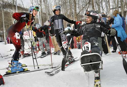 Scott Sommerdorf  |  The Salt Lake Tribune
Marty Retclaff (115) speaks with Tally Polukoff (left), and Hayes Graham (center) after his second run in The Ability Ski Challenge hosted at Park City Mountain Resort. The event that saw skiers with a wide range of abilities compete over the same course, was a  fundraiser for the National Ability Center, Saturday, March 5, 2011.