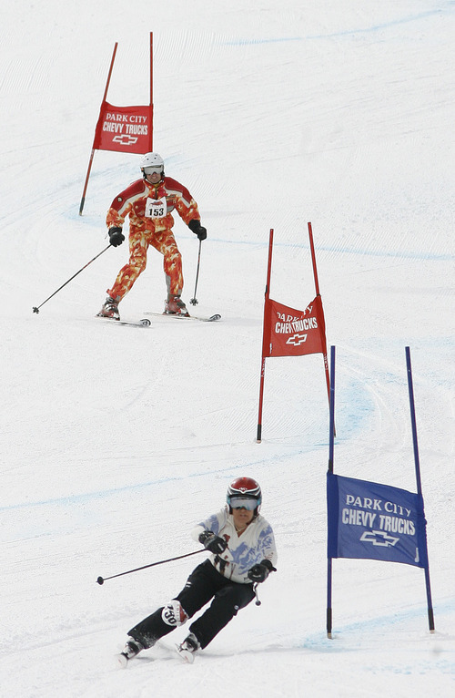 Scott Sommerdorf  |  The Salt Lake Tribune
Eric Hitzelberger (top) skis against Jana Lindsey during The Ability Ski Challenge hosted at Park City Mountain Resort. The event was a fundraiser for the National Ability Center. Skiers and snowboarders of all ages and abilities  compete to claim the top title in categories including Couch Potatoes, Weekend Warriors and Snow Shredders, Saturday, March 5, 2011.