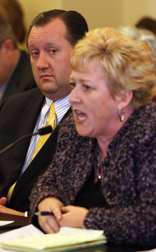 Leah Hogsten  |  The Salt Lake Tribune
Rep. John Dougall, left, listens as Linda Peterson, with the Utah Foundation for Open Government, gives her dissenting remarks on  HB477, which would substantially rewrite Utah's open-records law.