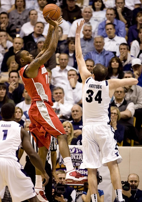 Djamila Grossman  |  The Salt Lake Tribune

Brigham Young University plays New Mexico in Provo on Wednesday, March 2, 2011. BYU's Noah Hartsock (34) blocks a shot by New Mexico's A.J. Hardeman (00) in the second half of the game. BYU lost the game.