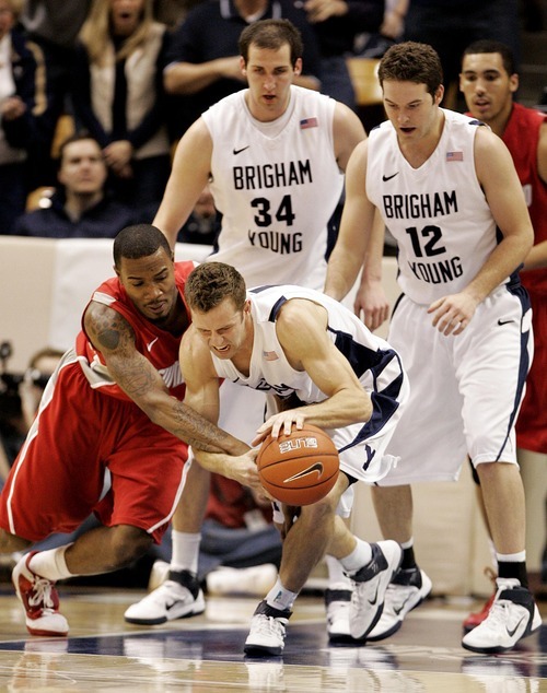 Djamila Grossman  |  The Salt Lake Tribune

Brigham Young University plays New Mexico in Provo on Wednesday, March 2, 2011. BYU's Jackson Emery (4) defends the ball against New Mexico's A.J. Hardeman (00) in the second half of the game, as BYU's Noah Hartsock (34) and Logan Magnusson (12) watch on. BYU lost the game.