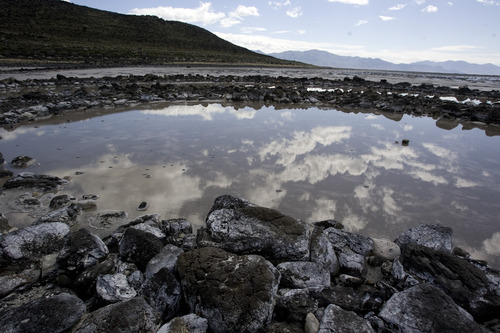 The clouds are reflected in the Spiral Jetty along the northern portion of the Great Salt Lake in 2009. Tribune file photo