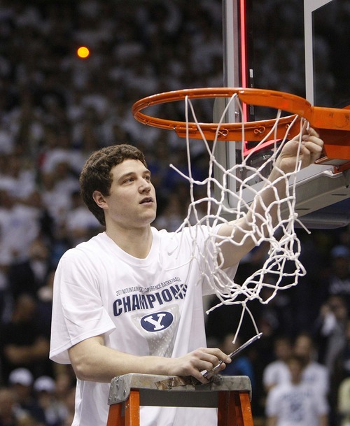Trent Nelson  |  The Salt Lake Tribune
BYU's Jimmer Fredette cuts a piece of the net in celebration after BYU defeated Wyoming, college basketball in Provo, Utah, Saturday, March 5, 2011.