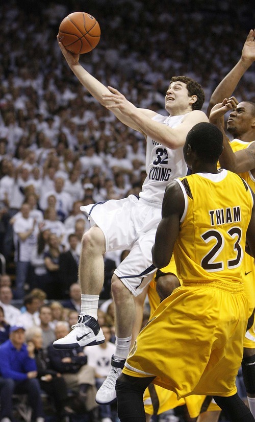 Trent Nelson  |  The Salt Lake Tribune
BYU's Jimmer Fredette drives to the basket as BYU hosts Wyoming, college basketball in Provo, Utah, Saturday, March 5, 2011.