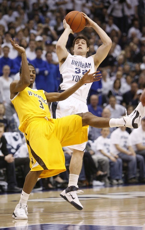 Trent Nelson  |  The Salt Lake Tribune
Wyoming's Desmar Jackson collides with BYU's Jimmer Fredette as BYU hosts Wyoming, college basketball in Provo, Utah, Saturday, March 5, 2011.
