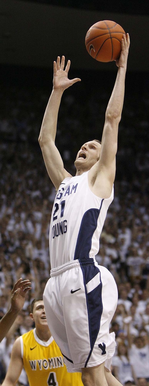 Trent Nelson  |  The Salt Lake Tribune
BYU's Stephen Rogers pulls down a rebound as BYU hosts Wyoming, college basketball in Provo, Utah, Saturday, March 5, 2011.