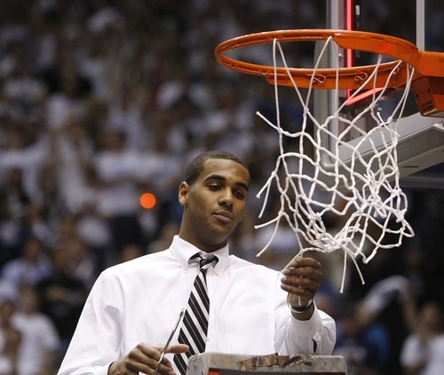 Trent Nelson  |  The Salt Lake Tribune
BYU's Brandon Davies cuts a piece of the net in celebration after BYU defeated Wyoming, college basketball in Provo, Utah, Saturday, March 5, 2011.