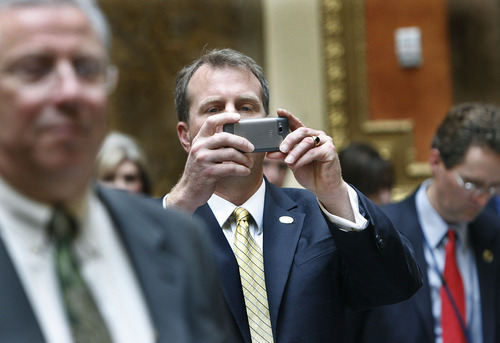 Scott Sommerdorf  |  The Salt Lake Tribune
Rep. Chris Herrod, R-Orem, stands to make a photo of former Jazz coach Jerry Sloan and assistant coach Phil Johnson in the Utah House of Representatives, Monday, March 7, 2011.