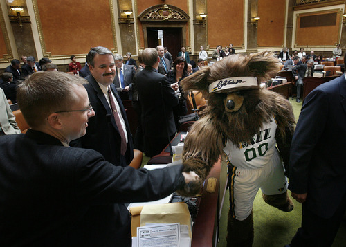 Scott Sommerdorf  |  The Salt Lake Tribune
Rep. Jeremy Peterson shakes hands (paws?) with the Jazz Bear as he leaves the House chamber Monday at the end of a ceremony honoring former Jazz coaches Jerry Sloan and Phil Johnson.