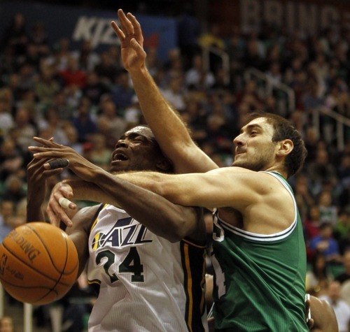 Rick Egan   |  The Salt Lake Tribune

Utah Jazz forward Paul Millsap is fouled by Boston Celtics guard Nenad Krstic on Monday at EnergySolutions Arena in Salt Lake City. The Jazz lost 107-102 before a sell-out crowd after committing defensive lapses down the stretch.