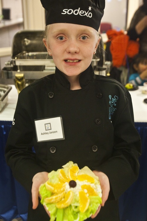 Chris Detrick | The Salt Lake Tribune
Ashley Janzen, a fourth-grader at Mill Creek Elementary, shows her salad during the first annual Future Chefs of America competition at the Granite Education Center.