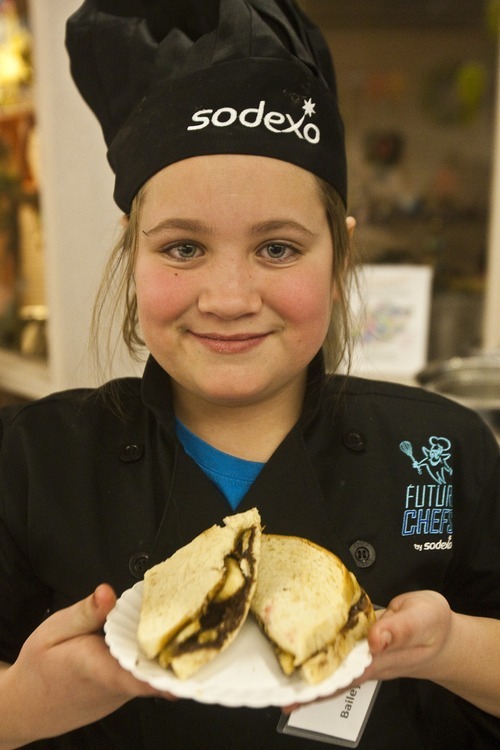 Chris Detrick | The Salt Lake Tribune 
Bailey Saddler, a fourth-grader at Pleasant Green Elementary, shows her Nutella snack during the first Future Chefs of America competition at the Granite Education Center.