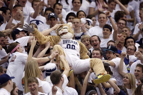 Trent Nelson  |  The Salt Lake Tribune
BYU mascot Cosmo crowd surfs over the student section as BYU hosts Wyoming, college basketball in Provo, Utah, Saturday, March 5, 2011.