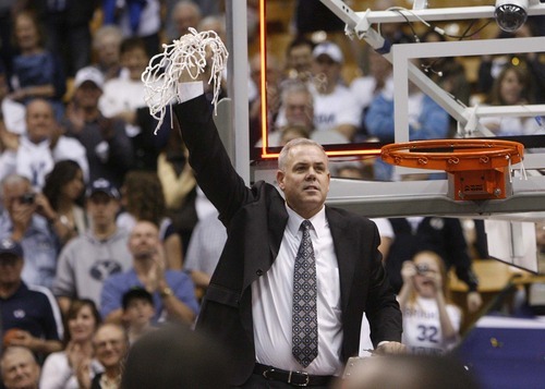 Trent Nelson  |  The Salt Lake Tribune
BYU coach Dave Rose cuts a piece of the net in celebration after BYU defeated Wyoming, college basketball in Provo, Utah, Saturday, March 5, 2011.