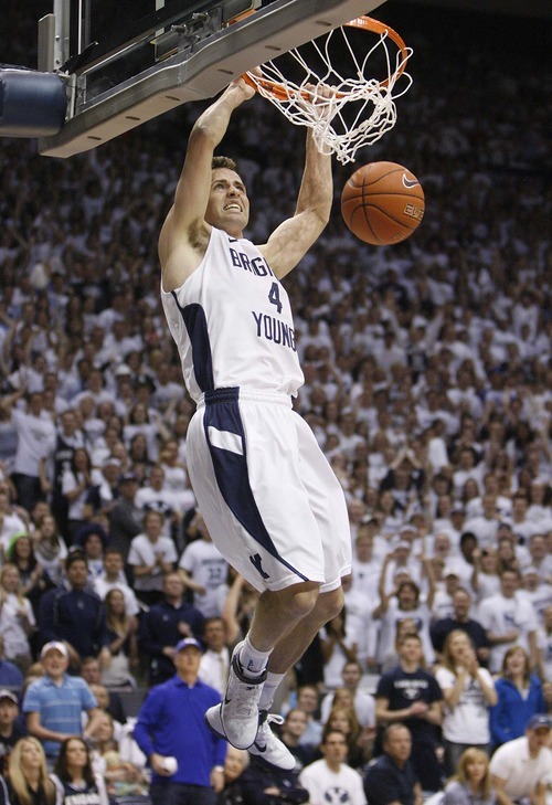 Trent Nelson  |  The Salt Lake Tribune
BYU's Jackson Emery dunks the ball as BYU hosts Wyoming, college basketball in Provo, Utah, Saturday, March 5, 2011.