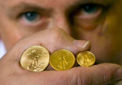 AL HARTMANN  |   Tribune File Photo
Bob Campbell at All About Coins in Sugarhouse last year shows some Golden Eagle coins. He holds 1/2 ounce, left, 1/4 ounce and 1/10 oz  Golden Eagles coins. The Legislature is moving toward final passage of a bill that would recognize gold and silver as legal tender in the state. The bill, HB317, would recognize their trading value -- not just face value -- and exempt sales from the personal gains tax.