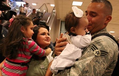 Leah Hogsten  |  The Salt Lake Tribune
Senior Airman Geiber Rea greets his daughter, Amelie, 5 months, for the first time as his wife, Cecilia, and daughter Heather, 7, watch.
