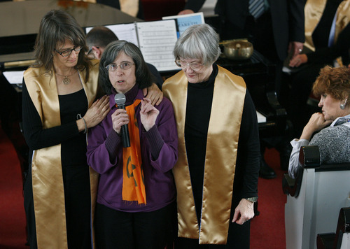 Scott Sommerdorf  |  The Salt Lake Tribune
Joan Gregory (center), is supported by choir members Krista Bowers (left) and Judy Lord as she speaks to the congregation about the Tim DeChristopher trial. The Unitarian Universalist Church in Salt Lake City showed it's support for Tim DeChristopher during it's service, Sunday, March 6, 2011.