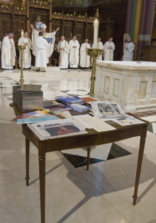 Bishop John Charles Wester (center rear) presides at a mass to  bless materials (on table in foreground) to be placed in a time capsule at the Cathedral of the Madeleine on  Monday, Feb. 22, 2010. Tribune file photo