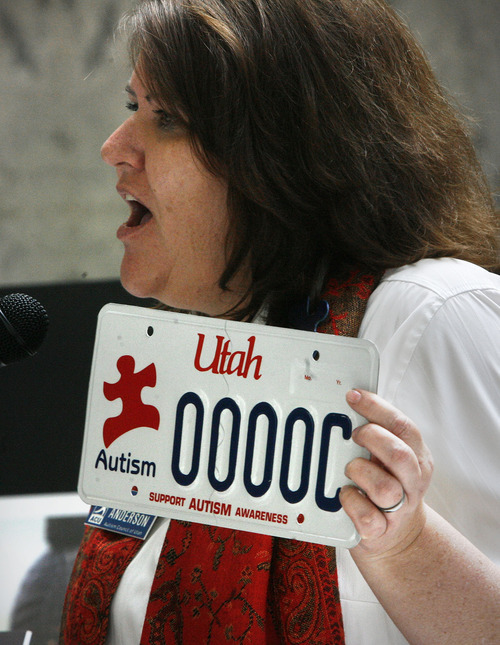 Scott Sommerdorf  |  The Salt Lake Tribune
Laura Anderson of the Autism Council of Utah shows the specialized autism license plate that Rep. Becky Anderson, R-North Salt Lake, was instrumental in establishing. The plate was shown at an Autism Council of Utah event in the Capitol rotunda, Thursday, March 10, 2011.