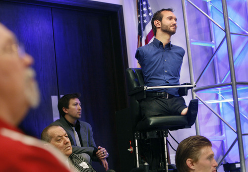 Scott Sommerdorf  |  The Salt Lake Tribune
Nick Vujicic waits to be introduced while listening to the choir sing at Mountain View Christian Assembly, Sunday, March 13, 2011. Vujicic was born without arms or legs, as a result of a rare disorder called Tetra-amelia. He is now a motivational preacher who speaks on life without limbs, life without limits. He spoke Sunday at Mountain View Christian Assembly.