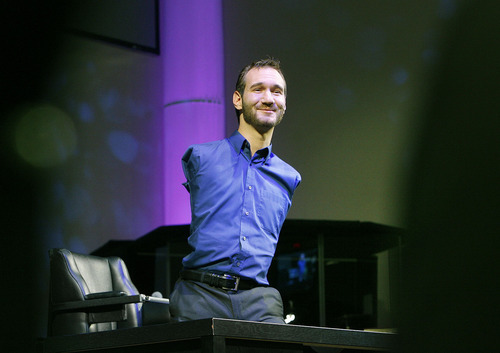 Scott Sommerdorf  |  The Salt Lake Tribune
Nick Vujicic speaks from atop a desk before a full house at Mountain View Christian Assembly in Sandy, Sunday, March 13, 2011. Vujicic was born without arms or legs, as a result of a rare disorder called Tetra-amelia. He is now a motivational preacher who speaks on life without limbs, life without limits.