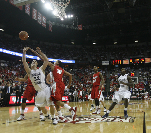 Rick Egan  | Salt Lake Tribune

BYU guard Jimmer Fredette (32) shoots for the Cougars, as 
m10 defends, in the Mountain West Conference Championships, BYU vs. New Mexico,  in Las Vegas, Friday, March 11, 2011.  Fredette had 52 points for the Cougars in their 87-76 win over the Lobos.