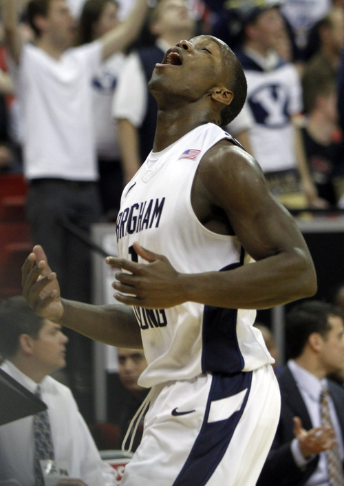 Rick Egan  | Salt Lake Tribune

BYU guard/forward Charles Abouo (1) reacts after a BYU steal was called back because of a foul,  in the Mountain West Conference Championships, BYU vs. New Mexico,  in Las Vegas, Friday, March 11, 2011.