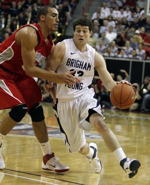 Rick Egan  | Salt Lake Tribune

BYU guard Jimmer Fredette (32) shoots for the Cougars, as A.J. Hardeman  defends, in the Mountain West Conference Championships, BYU vs. New Mexico,  in Las Vegas, Friday, March 11, 2011.  Fredette had 52 points for the Cougars in their 87-76 win over the Lobos.