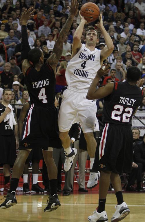 Rick Egan   |  The Salt Lake Tribune

BYU guard Jackson Emery (4) goes up for a shot, as San Diego State forward Malcolm Thomas (4) and San Diego State guard Chase Tapley (22) defend, 
in the Mountain West Championship game, BYU vs. San Diego State, in Las Vegas, Saturday, March 12, 2011