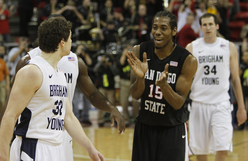 Rick Egan   |  The Salt Lake Tribune

As the Aztecs celebrate their big win, San Diego State forward Kawhi Leonard spends his time heckling BYU guard Jimmer Fredette (32) as the Cougars fell to the Aztecs 72-54 in the Mountain West Championship game, BYU vs. San Diego State, in Las Vegas, Saturday, March 12, 2011