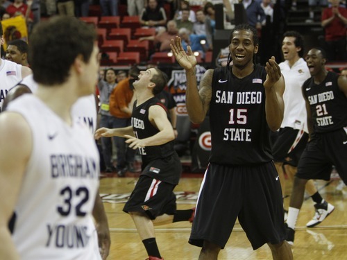 Rick Egan   |  The Salt Lake Tribune

As the Aztecs celebrate their big win, San Diego State forward Kawhi Leonard spends his time heckling BYU guard Jimmer Fredette (32) as the Cougars fell to the Aztecs 72-54 in the Mountain West Championship game, BYU vs. San Diego State, in Las Vegas, Saturday, March 12, 2011