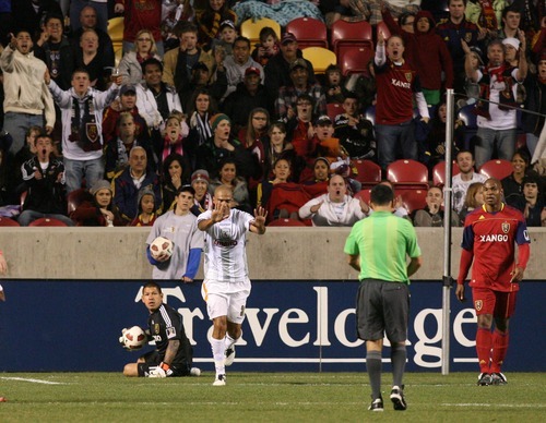 Leah Hogsten  |  The Salt Lake Tribune
Saprissa's Douglas Sequeira motions to the referee that he meant no roughing to Real's goalie Nick Rimando. 
Real Salt Lake  played the first  its two-game series against Saprissa of Costa Rica in the CONCACAF Champions League at Rio Tinto Stadium  Tuesday March 15, 2011.